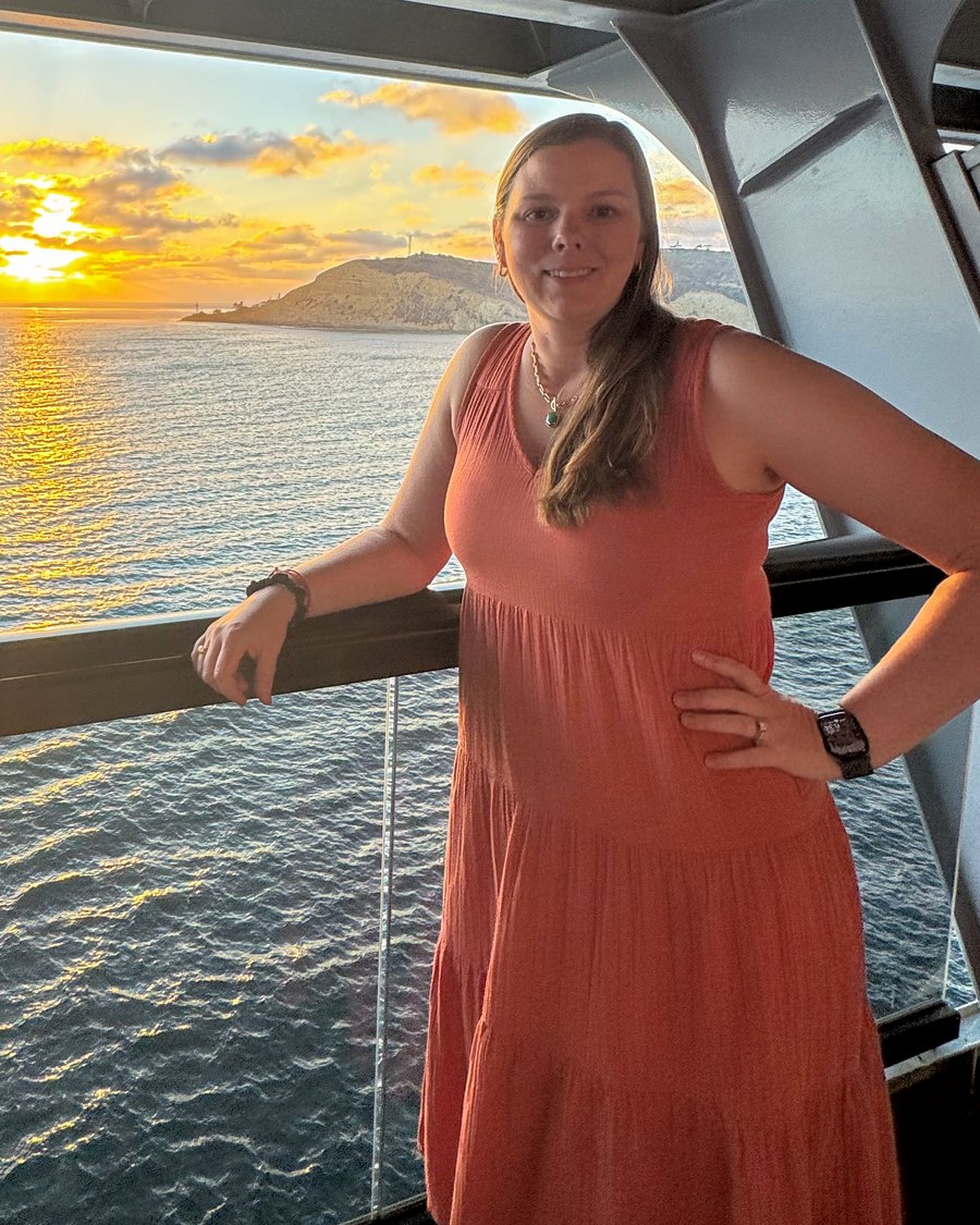 Victoria Dillon on a cruise ship balcony at sunset